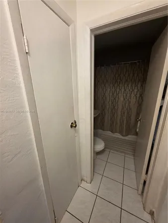 a bedroom with a bed and a desk