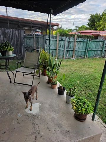 a view of a chairs and table in the patio