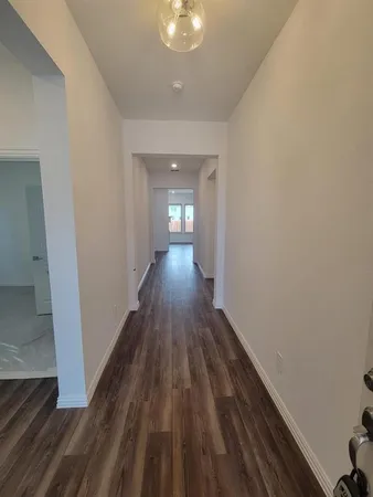 a view of gallery with wooden floor