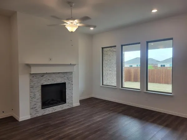 a living room with a fireplace and a window
