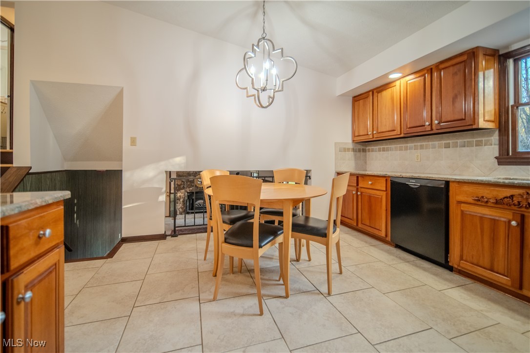 698 Albert Horning Road Atwater, OH 44201 - Photo 23 of 40 Dining space with light tile patterned floors and baseboards