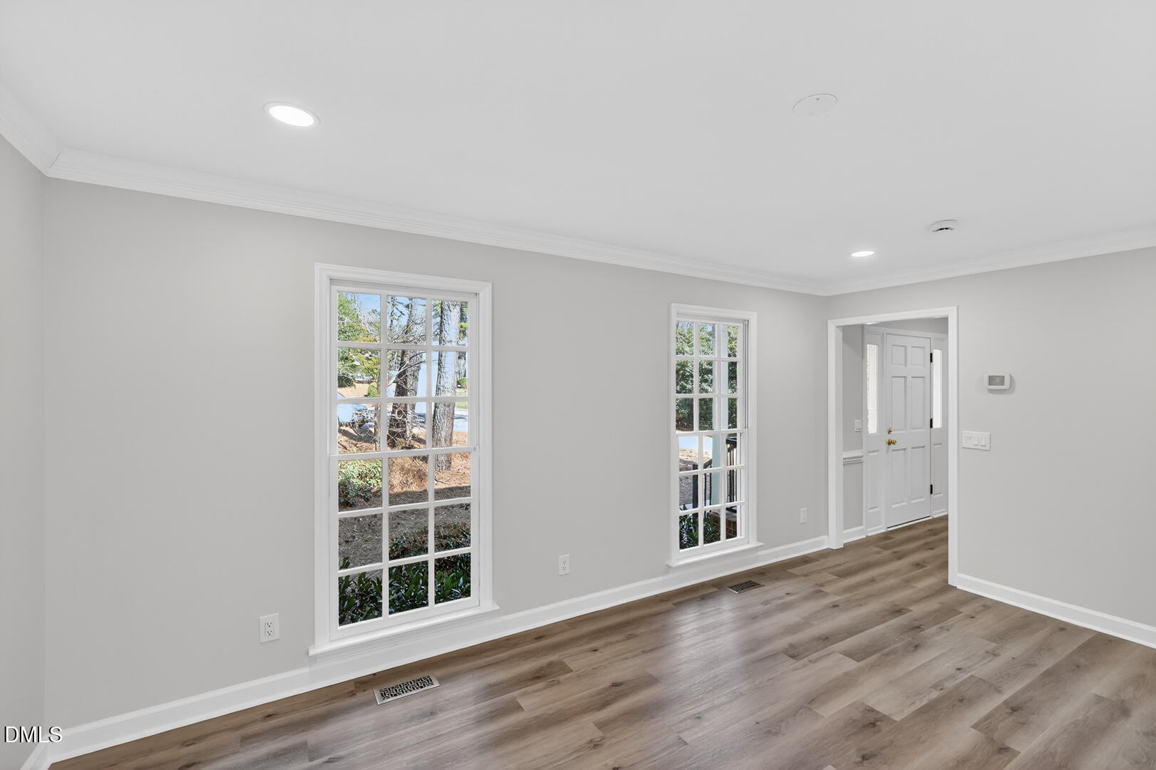 2224 Effingham Circle Raleigh, NC 27615 - Photo 19 of 51 a view of empty room with wooden floor and fan