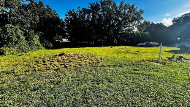 a view of yard with swimming pool and outdoor seating