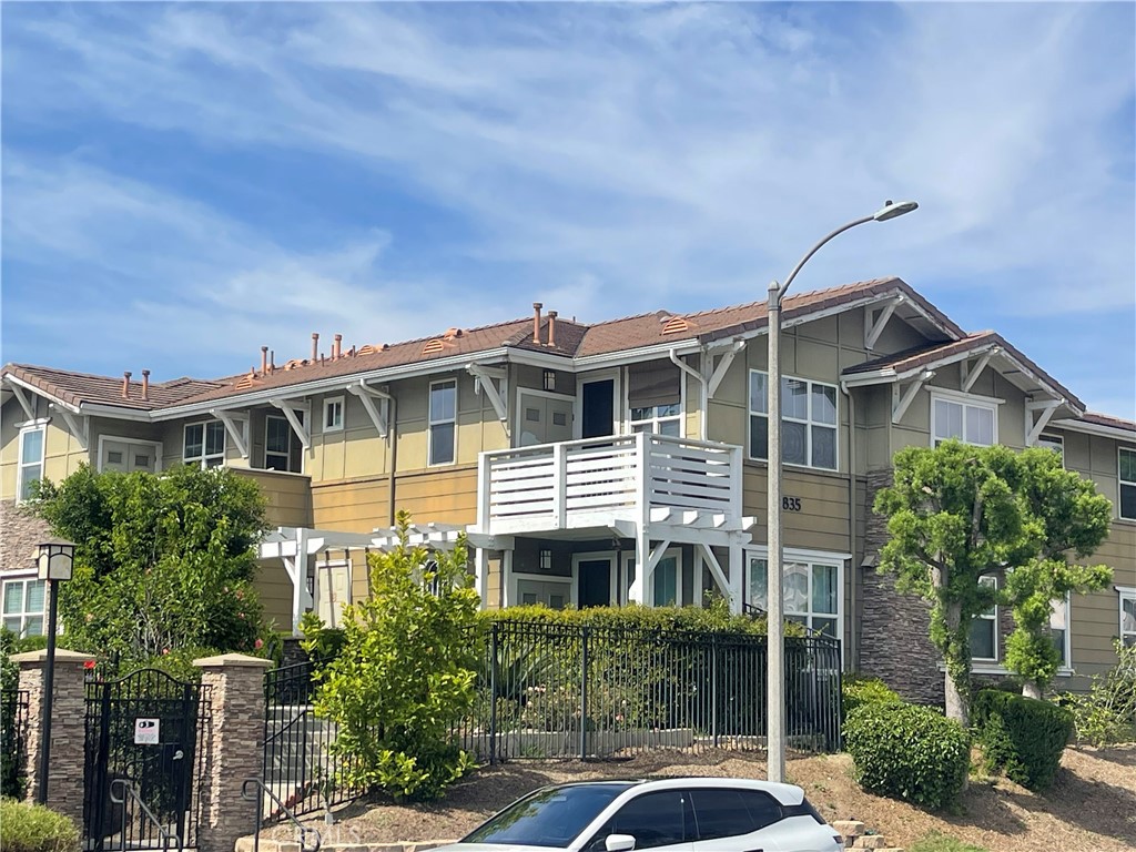 835 Francesca Drive, Unit 201 Walnut, CA 91789 - Photo 11 of 12 a front view of a house with a yard