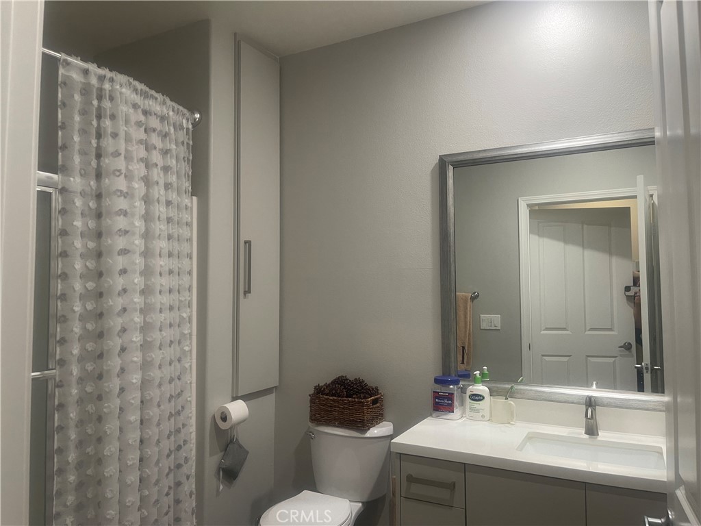 835 Francesca Drive, Unit 201 Walnut, CA 91789 - Photo 9 of 12 a bathroom with a sink toilet and shower