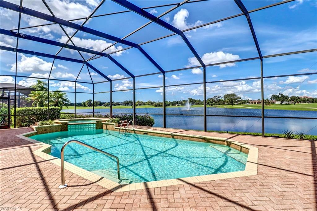 a view of a swimming pool with a lounge chairs