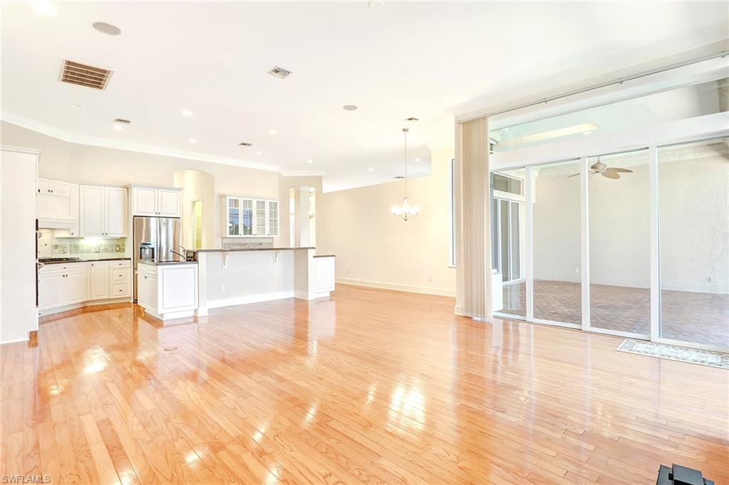 263 Monterey Drive Naples, FL 34119 - Photo 17 of 35 a view of a kitchen with wooden floor and a window