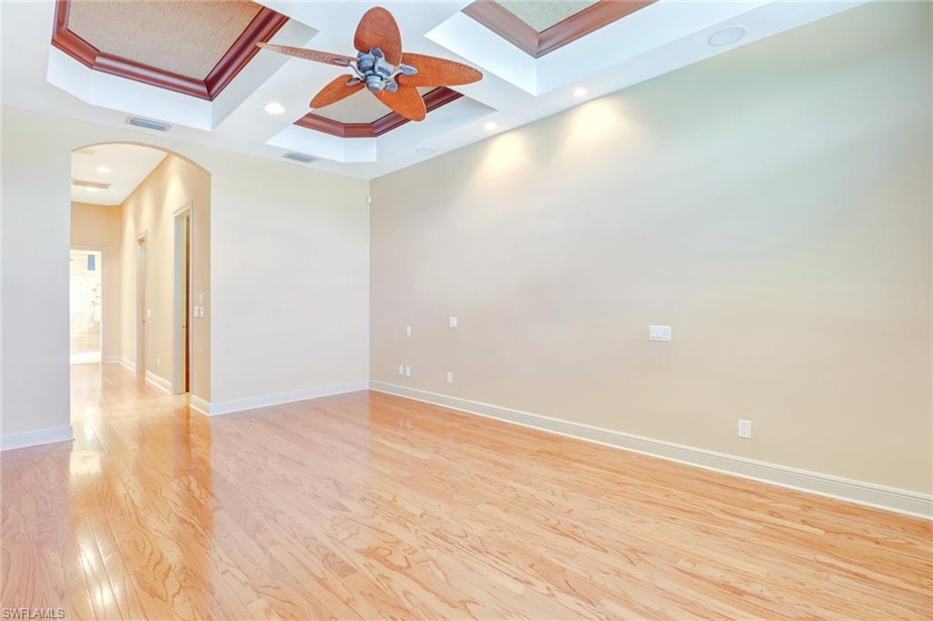 263 Monterey Drive Naples, FL 34119 - Photo 18 of 35 a view of empty room with wooden floor