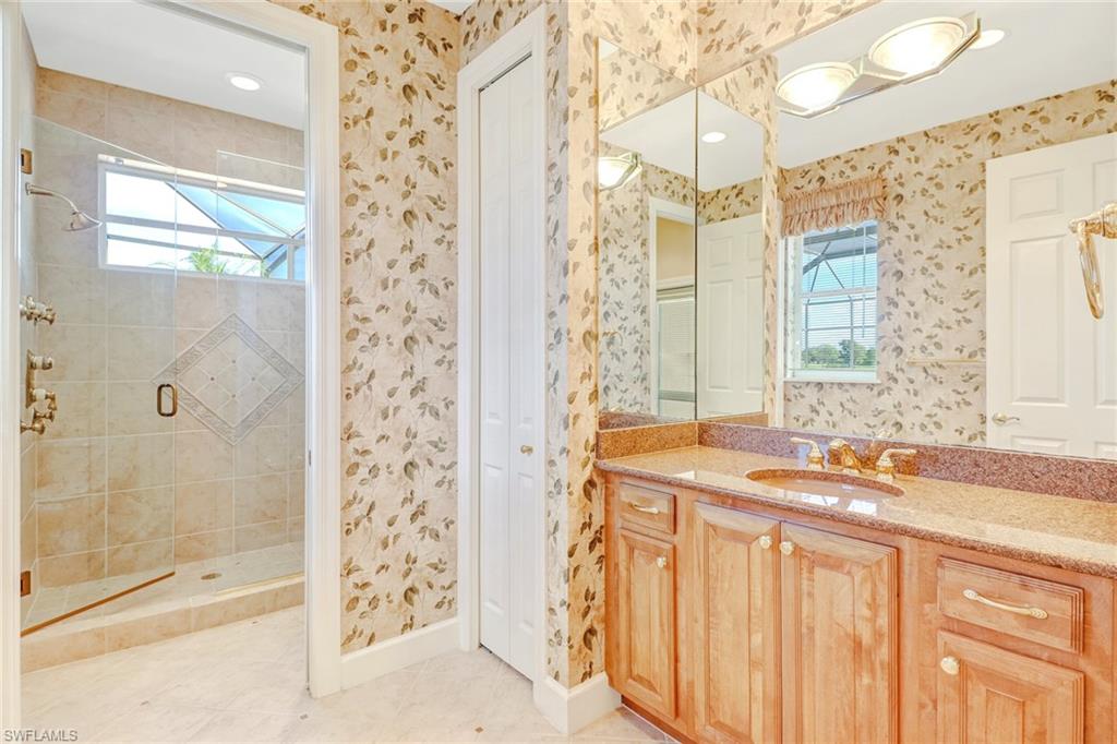 263 Monterey Drive Naples, FL 34119 - Photo 26 of 35 a bath room with a sink and a bath tub