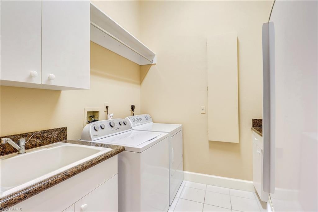 263 Monterey Drive Naples, FL 34119 - Photo 27 of 35 a utility room with dryer and washer