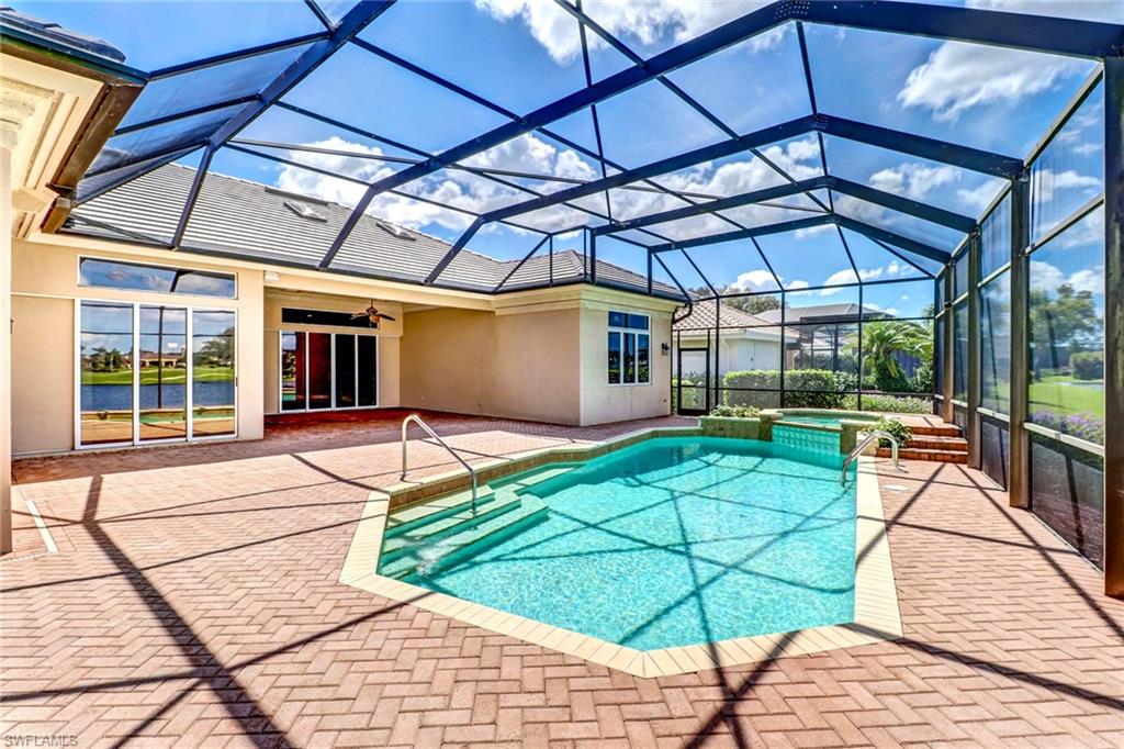 263 Monterey Drive Naples, FL 34119 - Photo 31 of 35 a patio with a yard table and chairs