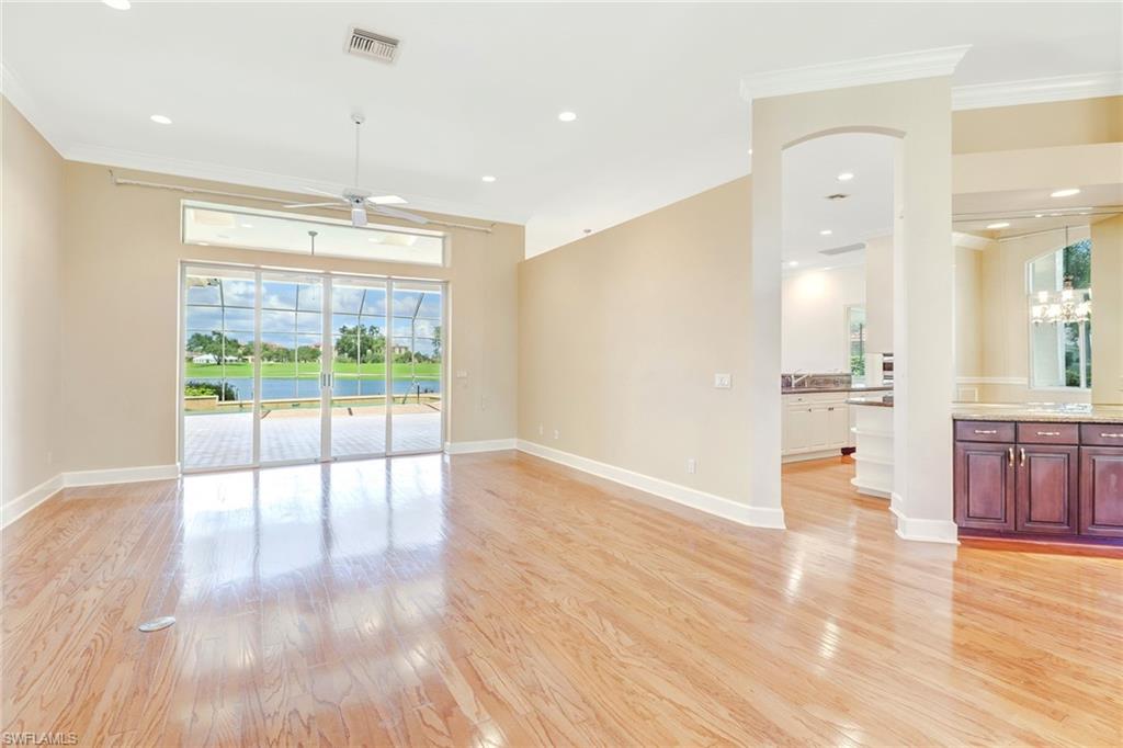263 Monterey Drive Naples, FL 34119 - Photo 7 of 35 a view of an empty room and wooden floor