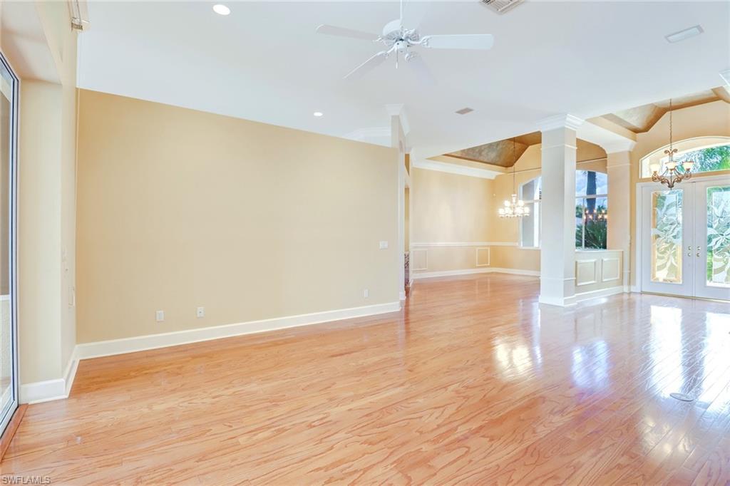 263 Monterey Drive Naples, FL 34119 - Photo 8 of 35 a view of empty room with wooden floor and fan
