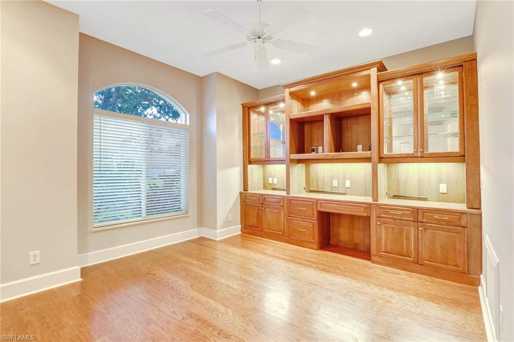 263 Monterey Drive Naples, FL 34119 - Photo 9 of 35 a large white kitchen with granite countertop a large window
