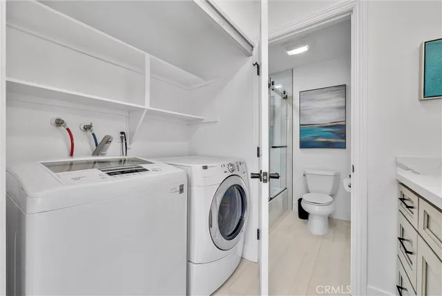 a bathroom with a shower and a glass door