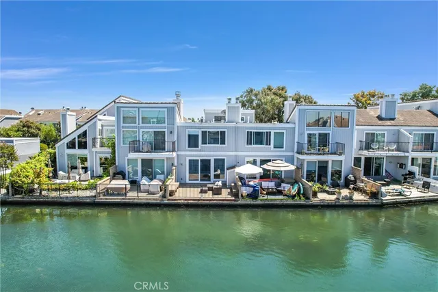 a view of a roof deck with couches and city view