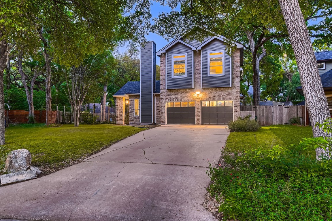 10103 Alcott Cove Austin, TX 78748 - Photo 1 of 1 a front view of a house with a yard and garage