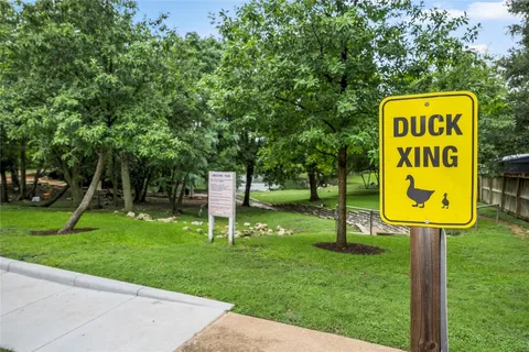a sign that is sitting on the of a park