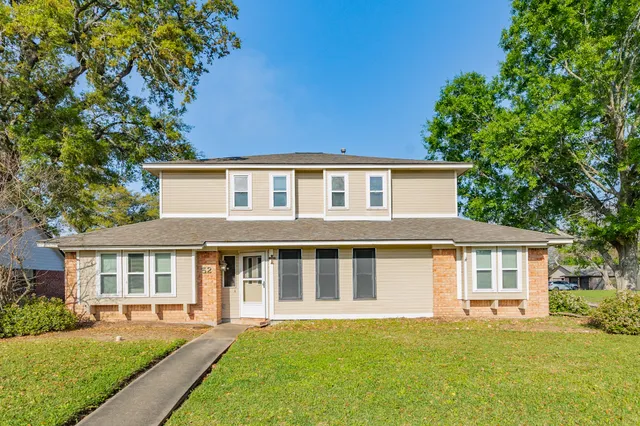 front view of a house with a yard