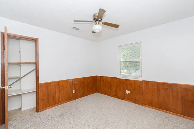 a view of an empty room and window