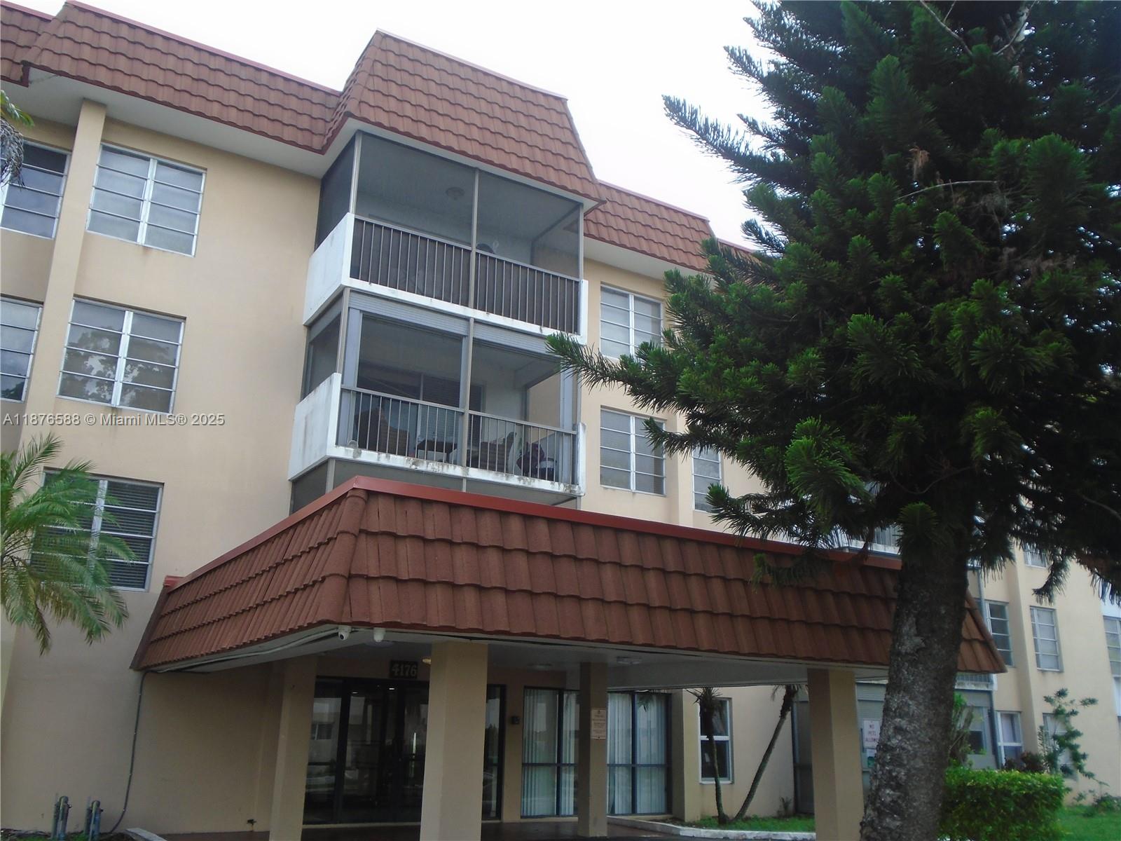4176 Inverrary Drive, Unit 209 Lauderhill, FL 33319 - Photo 2 of 15 a view of house with a window and balcony