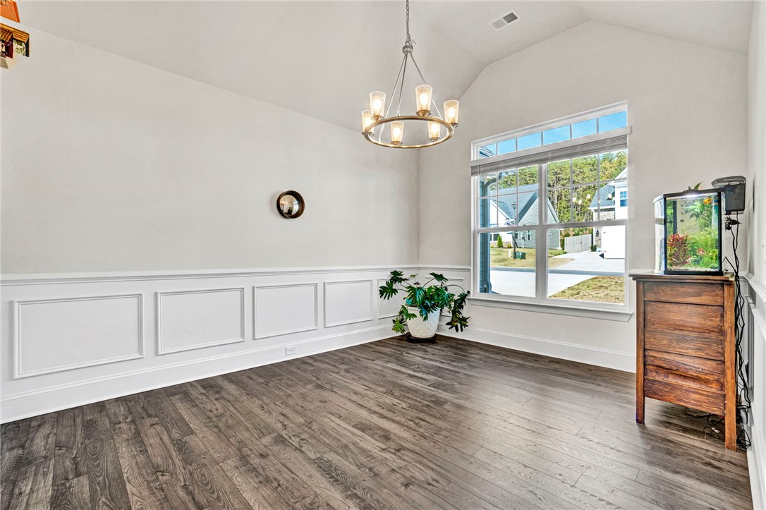 142 Juniper Hill Drive Easley, SC 29642 - Photo 7 of 47 This bright space features vaulted ceilings and classic wainscoting, perfect for diverse arrangements.
