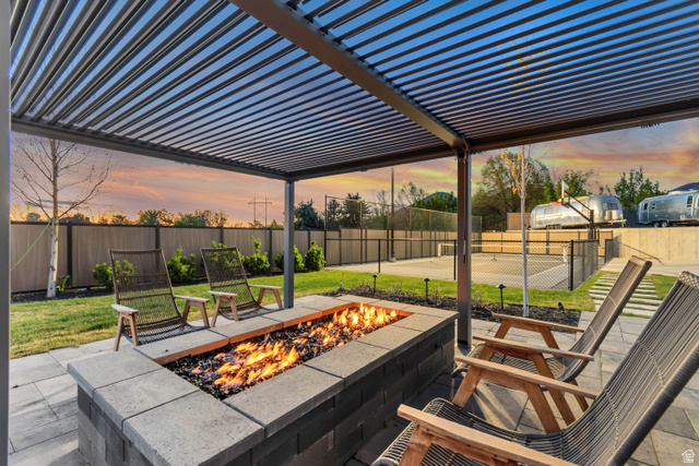 1720 Hillcrest Circle Mapleton, UT 84664 - Photo 19 of 116 Patio terrace at dusk with a pergola, a patio, and a fenced backyard
