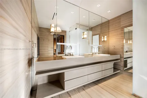 a bathroom with a sink a mirror and shower