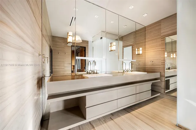 a bathroom with a sink a mirror and shower