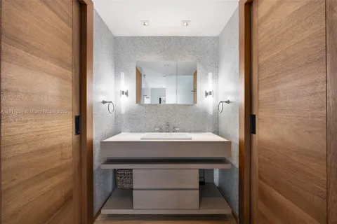 a bathroom with a toilet a sink and shower