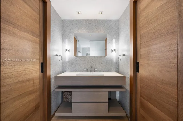 a bathroom with a toilet a sink and shower