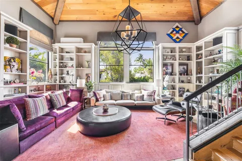 a view of a patio with a table and chairs