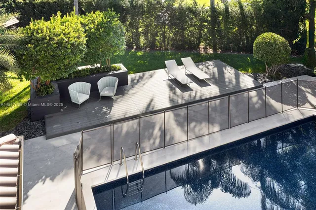 a view of a swimming pool with a patio