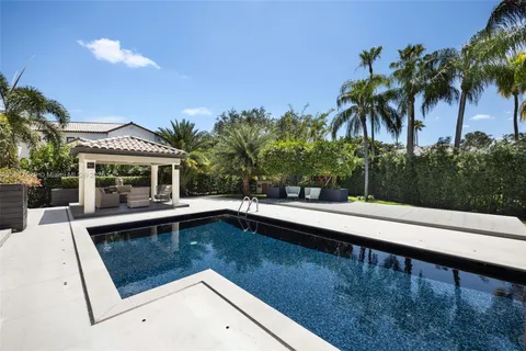 a view of a patio with table and chairs potted plants with wooden floor
