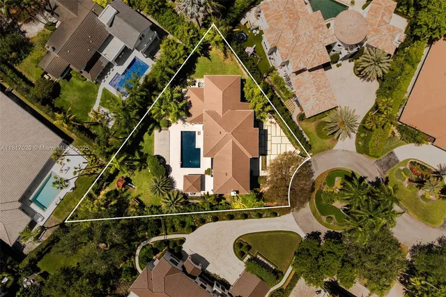 an aerial view of residential house with outdoor space and parking