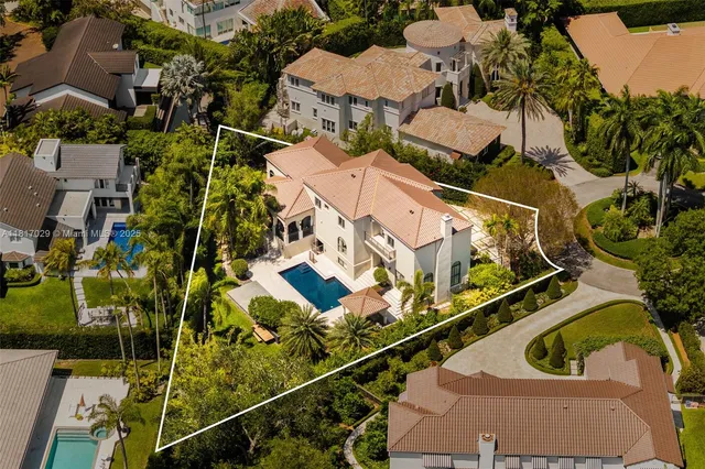 an aerial view of residential building with parking space