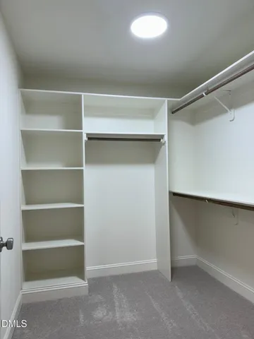 a view of an empty walk in closet