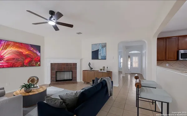 a living room with furniture and a fireplace