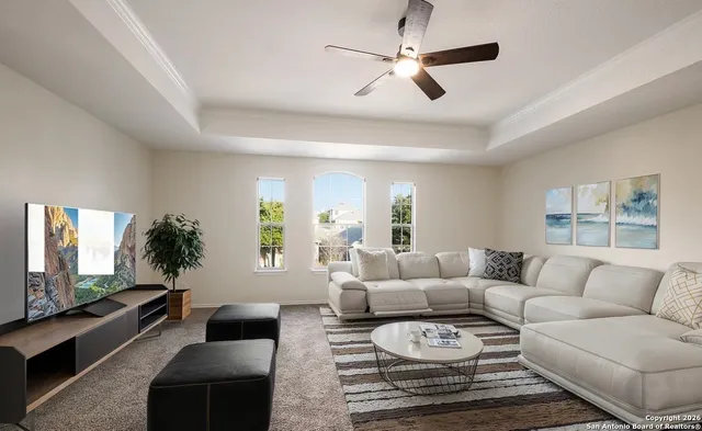 a living room with furniture and a flat screen tv