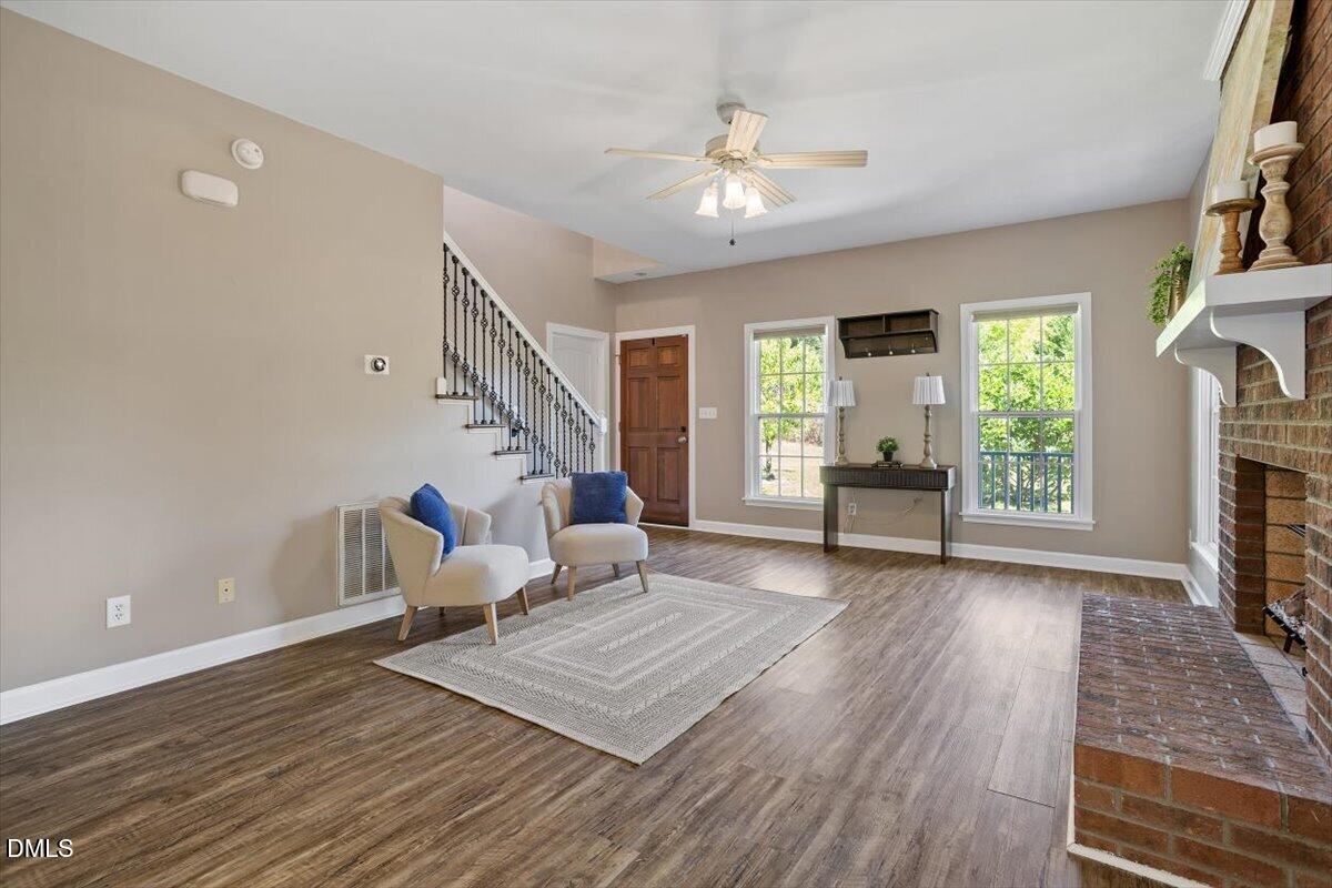 7505 Penny Road Raleigh, NC 27606 - Photo 12 of 35 a living room with furniture and a fireplace
