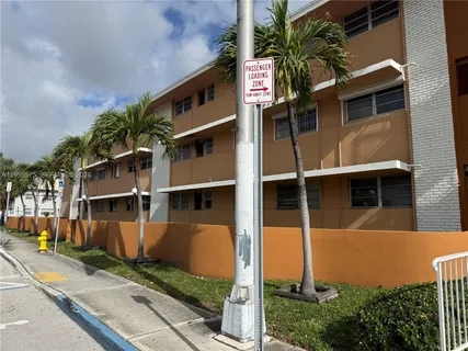 a view of a car park in front of house