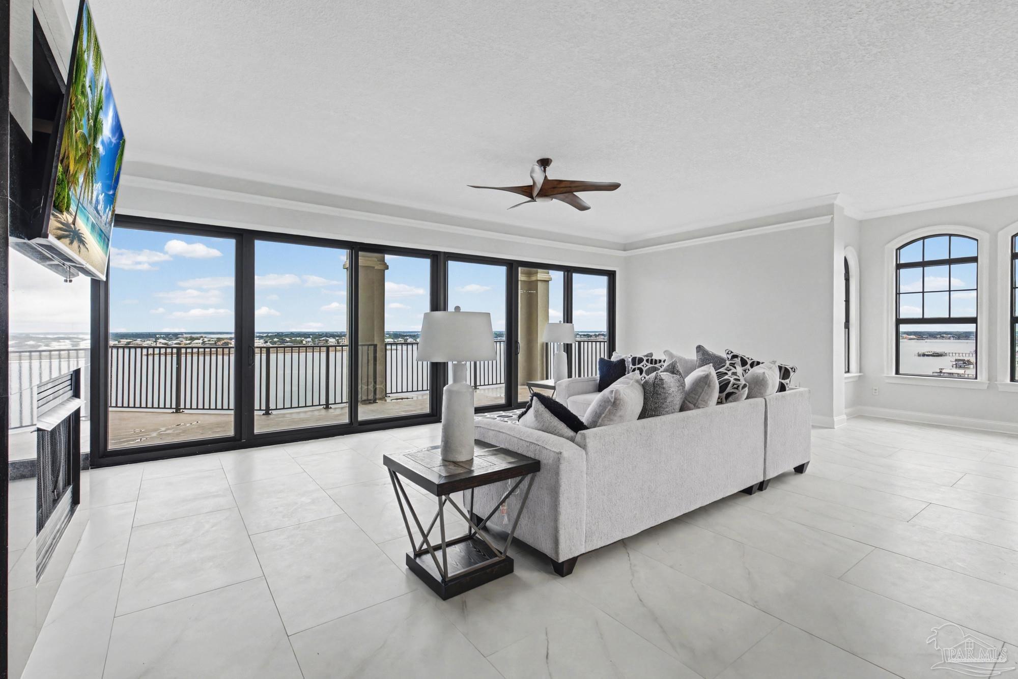 14900 River Road, Unit 904 Perdido Key, FL 32507 - Photo 5 of 62 a living room with furniture and a floor to ceiling window