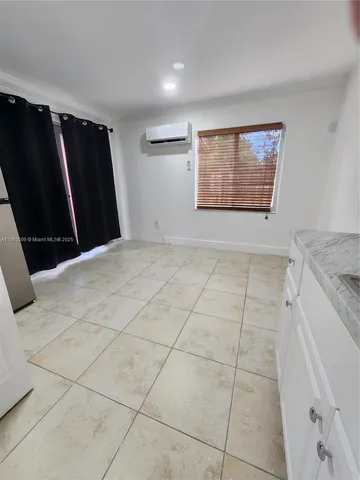 a view of empty room with windows