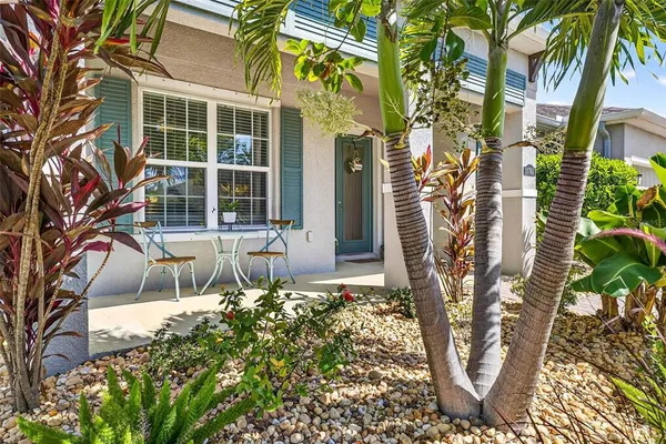 a dining room with furniture and a window