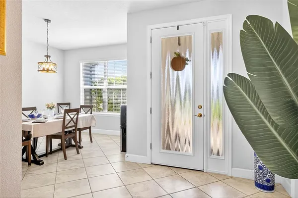 a kitchen with kitchen island granite countertop wooden cabinets and white appliances