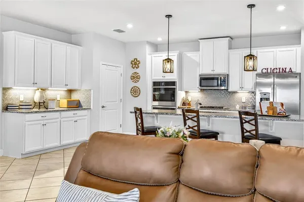 a bathroom with a sink a mirror and a shower