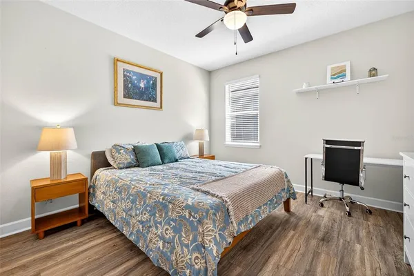 an aerial view of residential houses with outdoor space and ocean view