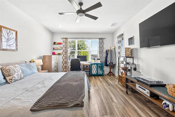 a swimming pool with outdoor seating and city view