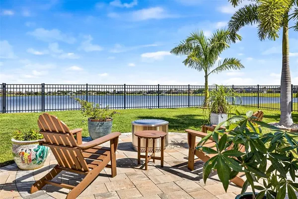 a view of a chairs and table in patio