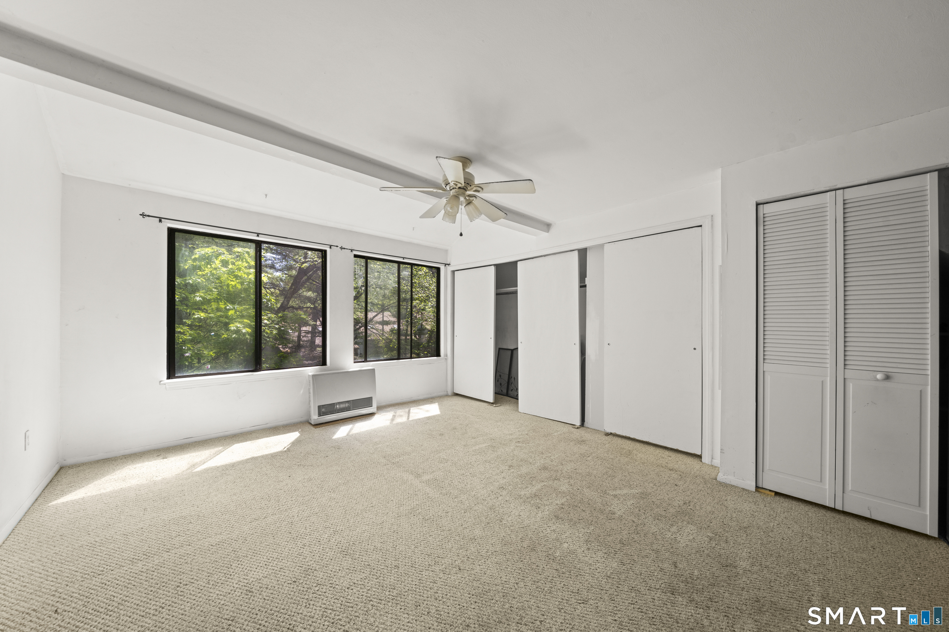 39 Evergreen Road, Unit 39 Torrington, CT 06790 - Photo 15 of 27 a view of a livingroom with a ceiling fan and window